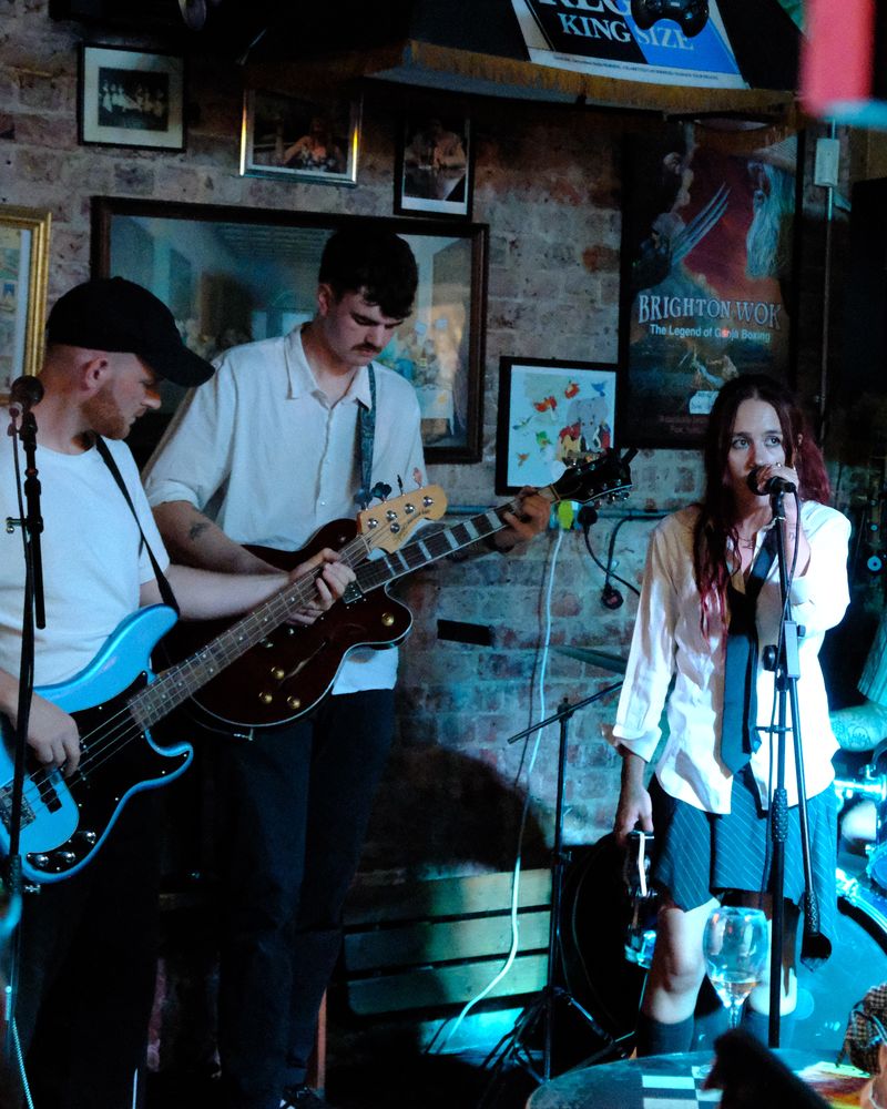 mollywater and the band on stage at a Brighton pub
