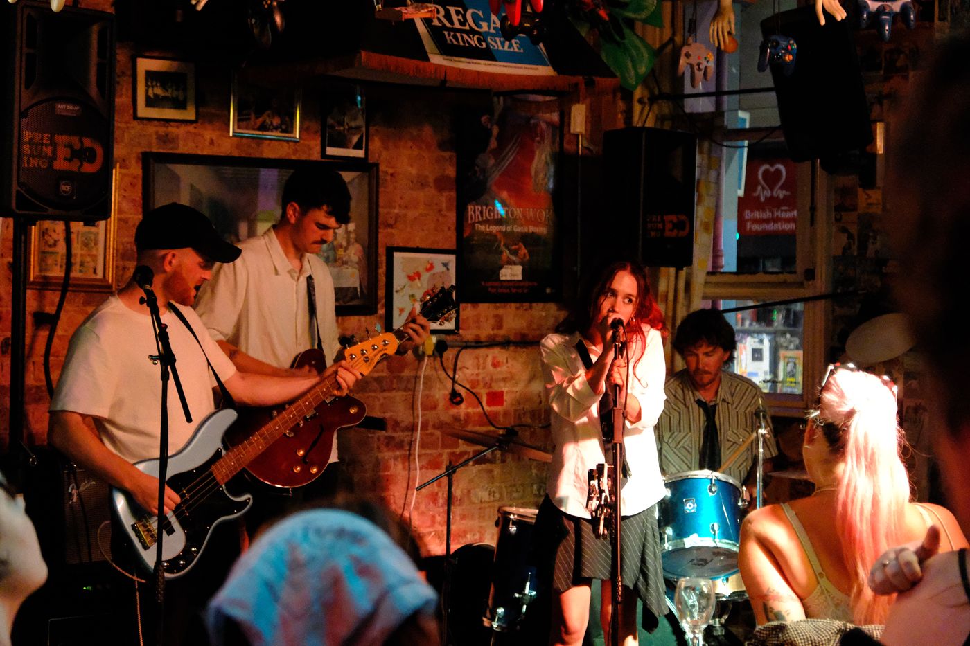 mollywater and the band playing live in a pub under warm light